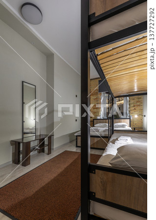 Modern Hostel Dormitory Room with Bunk Beds and Double Bed Modern Hostel Dormitory Room with Bunk Beds and Double Bed 137727292