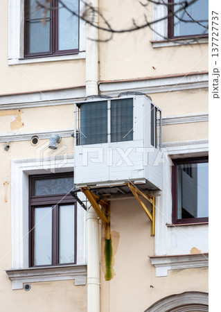 air conditioning on facade of building, air cooling in hot weather.  137727737