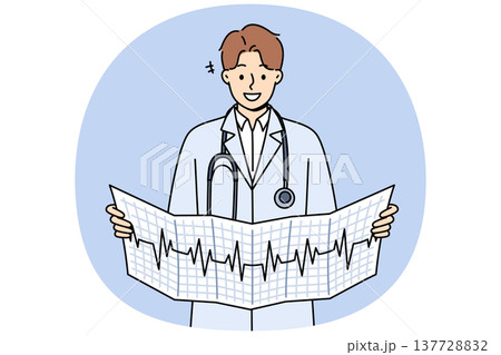 Man cardiologist holds result of ecg and smiles, standing in white coat with stethoscope around neck 137728832