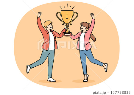Joint victory two schoolchildren, joyfully holding golden cup for participating in intellectual game Joint victory two schoolchildren, joyfully holding golden cup for participating in intellectual game 137728835