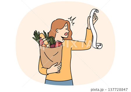 Huge bill for healthy food shocks young woman who opens mouth, reading store receipt Huge bill for healthy food shocks young woman who opens mouth, reading store receipt 137728847