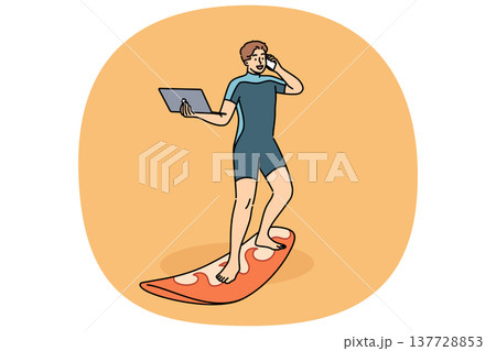Business man works standing on surfboard, with laptop and mobile phone in hands. 137728853