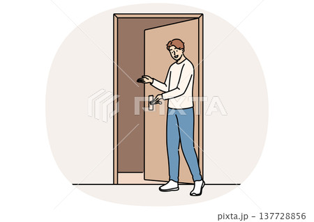 Man says welcome standing near door and shows inviting gesture when friends come to visit Man says welcome standing near door and shows inviting gesture when friends come to visit 137728856