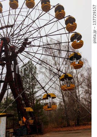 Abandoned Ferris Wheel in the amusement park of ghost town Pripyat in Chernobyl Exclusion Zone, Ukraine Abandoned Ferris Wheel in the amusement park of ghost town Pripyat in Chernobyl Exclusion Zone, Ukraine 137729157