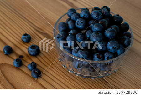 View of a glass bowl filled with blueberries View of a glass bowl filled with blueberries 137729530