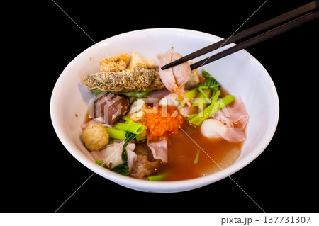 Top view of Yentafo Pink seafood flat noodles with fish meatballs, focus selective 137731307