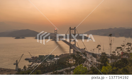 Iconic Suspension Bridge Illuminated At Sunset Over Tranquil Waters Feb 21 2026 Iconic Suspension Bridge Illuminated At Sunset Over Tranquil Waters Feb 21 2026 137734192