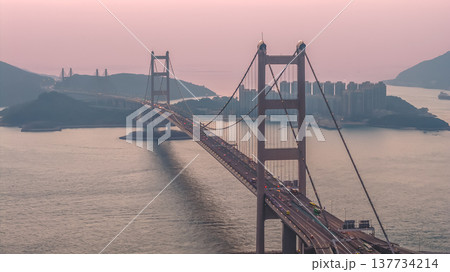 Iconic Suspension Bridge Illuminated At Sunset Over Tranquil Waters Feb 21 2026 Iconic Suspension Bridge Illuminated At Sunset Over Tranquil Waters Feb 21 2026 137734214