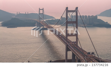 Iconic Suspension Bridge Illuminated At Sunset Over Tranquil Waters Feb 21 2026 137734216