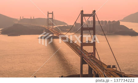 Iconic Suspension Bridge Illuminated At Sunset Over Tranquil Waters Feb 21 2026 Iconic Suspension Bridge Illuminated At Sunset Over Tranquil Waters Feb 21 2026 137734222