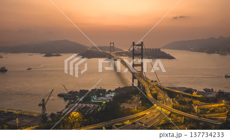 Iconic Suspension Bridge Illuminated At Sunset Over Tranquil Waters Feb 21 2026 Iconic Suspension Bridge Illuminated At Sunset Over Tranquil Waters Feb 21 2026 137734233