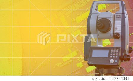 Geodetic instrument on the background of a residential area in the form of a project. Geodesy in construction and design 137734341