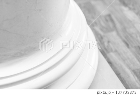 Detailed view of a classic white marble column base 137735875