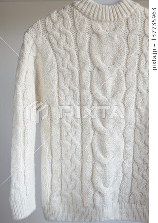 Children's warm white wool sweater isolated on white background Children's warm white wool sweater isolated on white background 137735963