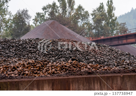 Site at a mining processing plant. A pile of stones Site at a mining processing plant. A pile of stones 137738947