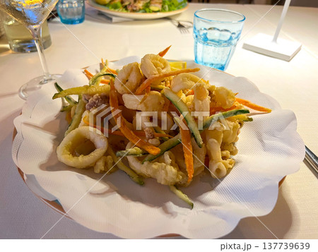 View of a plate of deep-fried seafood in an Italian restaurant 137739639