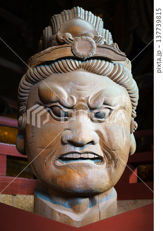 Nara, Japan - Sep 26 2024, vertical, Close-up view of the head of a wooden statue of one of wrathful guardians of the Four Directions, in Todaiji Temple, without people, Nara, Japan 137739815