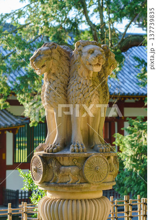 Nara, Japan - Sep 26 2024, vertical view of statue of three lions looking in different directions landmark on territory of Todaiji Temple, trees in background, without people, at daytime, Nara, Japan Nara, Japan - Sep 26 2024, vertical view of statue of three lions looking in different directions landmark on territory of Todaiji Temple, trees in background, without people, at daytime, Nara, Japan 137739835