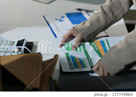 Business woman accountant working in office checking financial accounts and allocating company budgets. Business woman accountant working in office checking financial accounts and allocating company budgets. 137739969