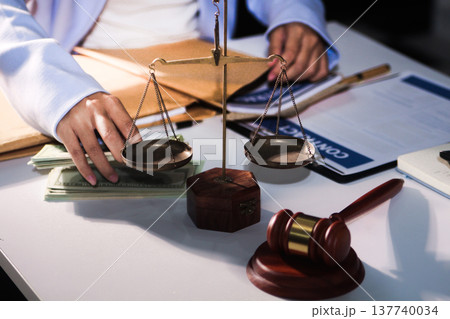 Consultation and conference of professional businesswoman and Male lawyers working and discussion having at law firm in office. Concepts of law, Judge gavel with scales of justice Consultation and conference of professional businesswoman and Male lawyers working and discussion having at law firm in office. Concepts of law, Judge gavel with scales of justice 137740034