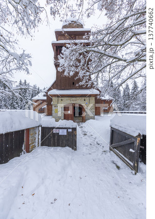 Historic wooden articular church standing in winter snow in Svaty Kriz 137740662
