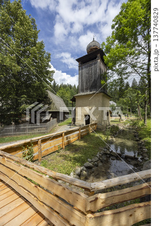 Traditional Slovak Orava village bell tower and wooden fence 137740829