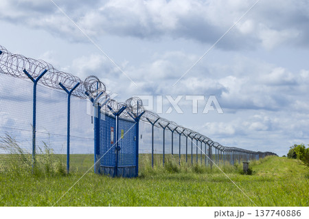 Security fence with barbed wire and gate in Hostivice 137740886