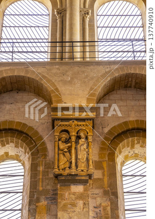 Romanesque stone carving depicting Mary and angel Gabriel inside Conques Abbey 137740910