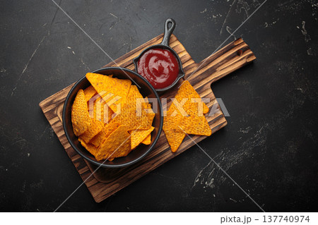 Nachos tortilla chips salsa dip wooden board Mexican Tex-Mex snack fast food 137740974