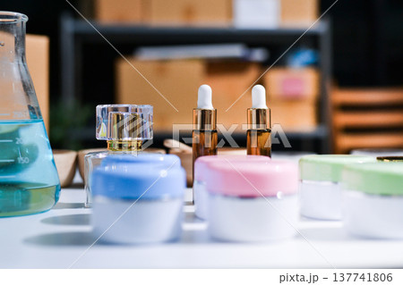 Woman making organic cosmetics with aloe in laboratory Woman making organic cosmetics with aloe in laboratory 137741806