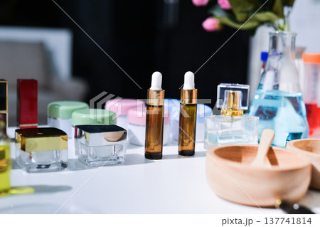 Woman making organic cosmetics with aloe in laboratory Woman making organic cosmetics with aloe in laboratory 137741814