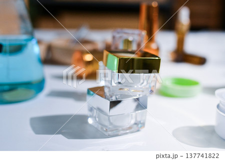 Woman making organic cosmetics with aloe in laboratory Woman making organic cosmetics with aloe in laboratory 137741822