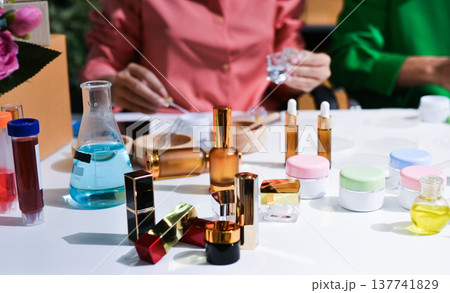 Woman making organic cosmetics with aloe in laboratory Woman making organic cosmetics with aloe in laboratory 137741829