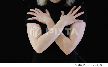 closed position, arms folded crosswise, secrecy, shyness, closednes 137741860