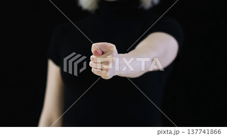 A graceful female hands showing a fig 137741866