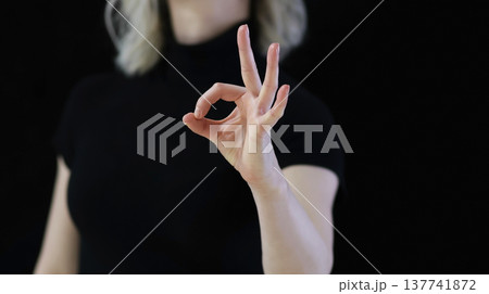 a hand symbol with a finger folded, meaning OK a hand symbol with a finger folded, meaning OK 137741872