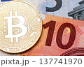Ten euro banknote as a background for golden bitcoin. 137741970