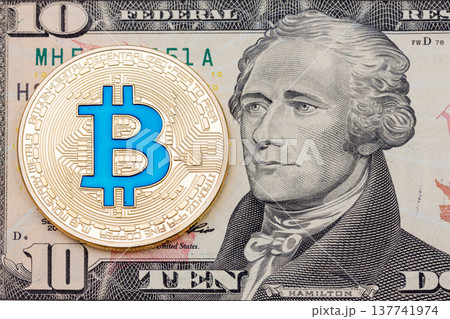 Golden cryptocurrency blue bitcoin on ten dollar banknote backgr Golden cryptocurrency blue bitcoin on ten dollar banknote backgr 137741974
