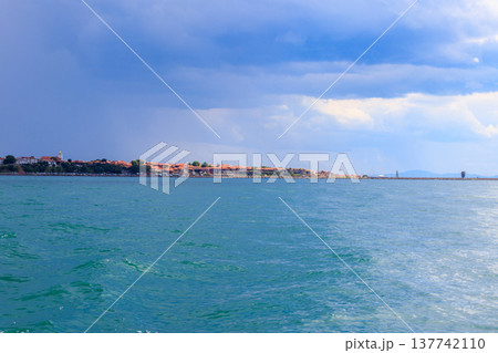 View of the old town of Nessebar and the Black sea, Bulgaria. View from a sea View of the old town of Nessebar and the Black sea, Bulgaria. View from a sea 137742110