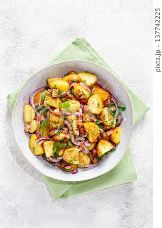 German potato salad, with bacon, onion and herbs, served in a bowl, homemade, no people, German potato salad, with bacon, onion and herbs, served in a bowl, homemade, no people, 137742225