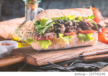 Beef sandwich with tomato and salad Beef sandwich with tomato and salad 137742246