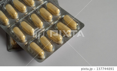 Magnesium vitamins MG in a blister on a white background 137744891