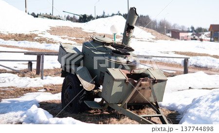 Decommissioned Tank Turret In Snow, Rural Roadside Relic By Frozen Field Rusted Armor Plates, Broken Optics, Trailer Hitch And Scattered Metal Parts Suggest Postconflict Abandonment Muted Decommissioned Tank Turret In Snow, Rural Roadside Relic By Frozen Field Rusted Armor Plates, Broken Optics, Trailer Hitch And Scattered Metal Parts Suggest Postconflict Abandonment Muted 137744898