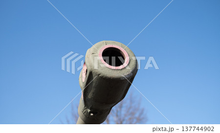 Frontfacing Tank Barrel With Detailed Concentric Bore And Pink Rim. Testing Site With Tank Barrel Muzzle Directed Upward Against Vibrant Blue Sky With Detailed Rim And Bore 137744902
