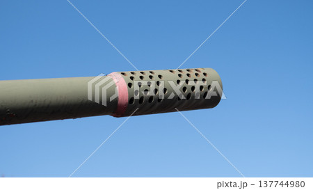 Industrial Style Image Emphasizing Textured Holes And Bright Ring Details. Product Shot Highlighting Perforated Barrel Pattern And Eyecatching Pink Ring Against Simple Sky Background 137744980