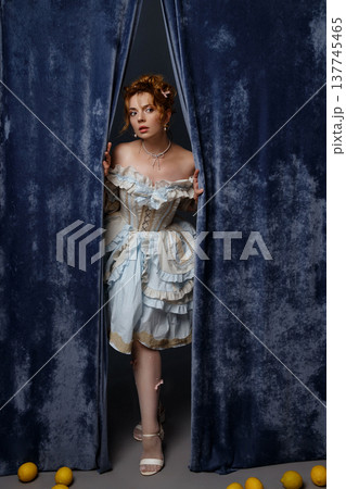 Vintage Woman Peering. Woman Peeks From Backstage Area. Curious Woman Steps Into Faint Illumination Vintage Woman Peering. Woman Peeks From Backstage Area. Curious Woman Steps Into Faint Illumination 137745465