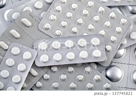 Big heap of many various pills and tablets packs and blisters 137745821