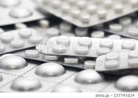 Big heap of many various pills and tablets packs and blisters Big heap of many various pills and tablets packs and blisters 137745824