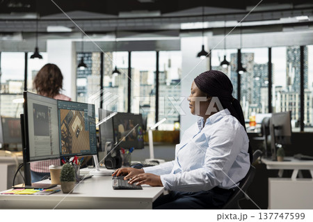 African american interior designer using architectural CAD interface, woman architect working with 3D rendering for apartment floor plan or layout. Professional computer graphics. 137747599