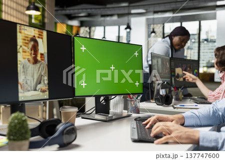 Chroma key screen, PC reels on software, in modern office, startup employee developing marketing strategy used in targeting viral trends and boosting online followers and exposure. 137747600